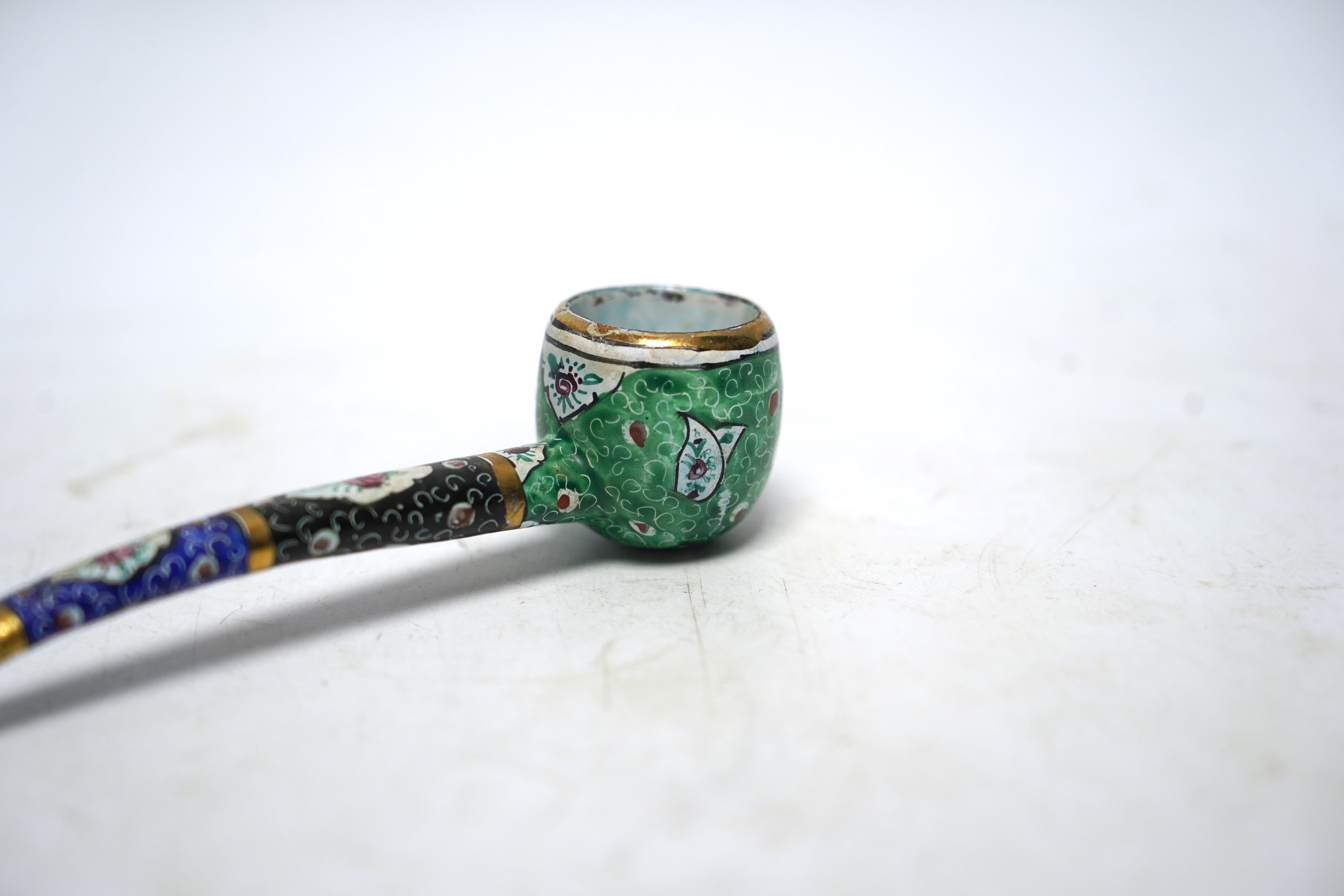 A Persian multicoloured enamelled pipe, 14cm long